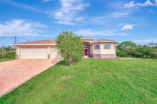 view of front of property with a front lawn and a garage