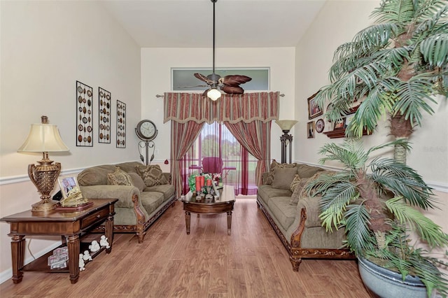 living room featuring ceiling fan and light wood-type flooring