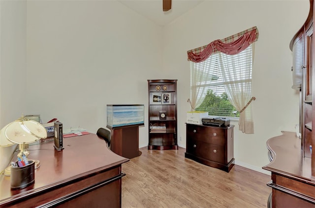 office area with ceiling fan and light wood-type flooring