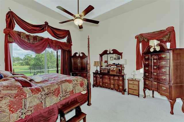 bedroom featuring access to exterior, light carpet, and ceiling fan