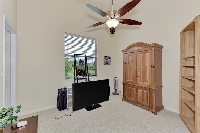 office space with light colored carpet and ceiling fan