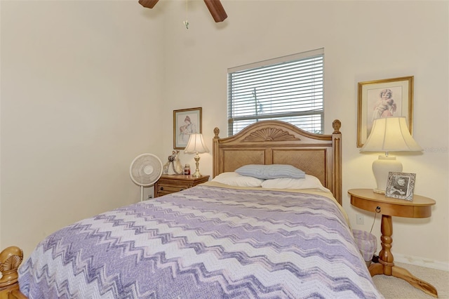 bedroom featuring ceiling fan and carpet