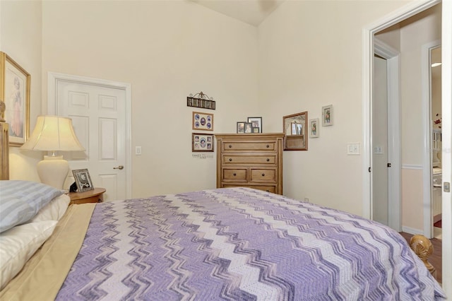 bedroom with a towering ceiling