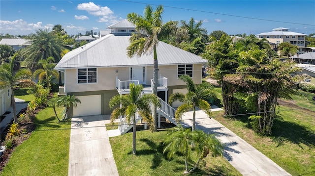 view of front facade with a front yard and a garage