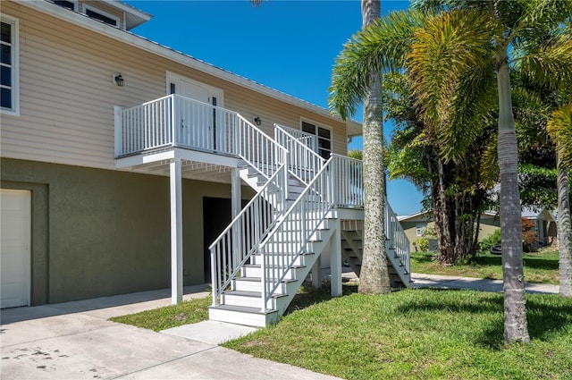 exterior space featuring a front lawn and a garage