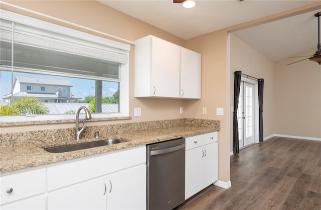 kitchen with white cabinetry, dark wood-type flooring, sink, light stone counters, and dishwasher