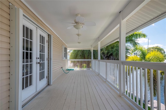 wooden terrace featuring ceiling fan