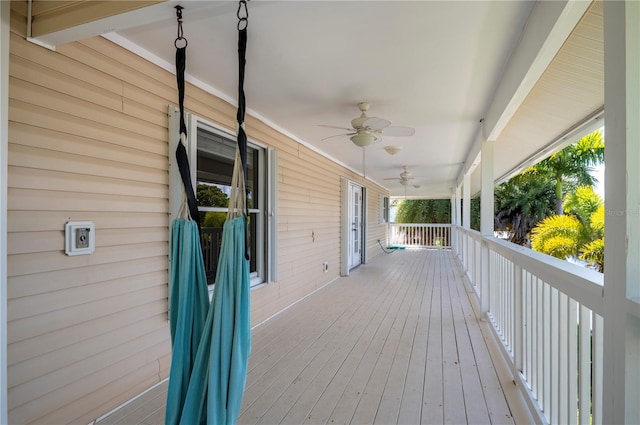 wooden terrace with ceiling fan