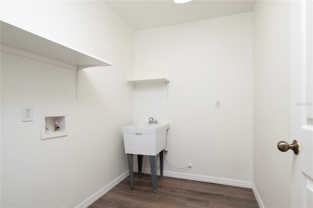 clothes washing area with washer hookup and dark hardwood / wood-style flooring