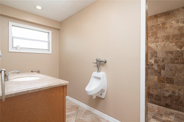 bathroom featuring vanity and tile flooring