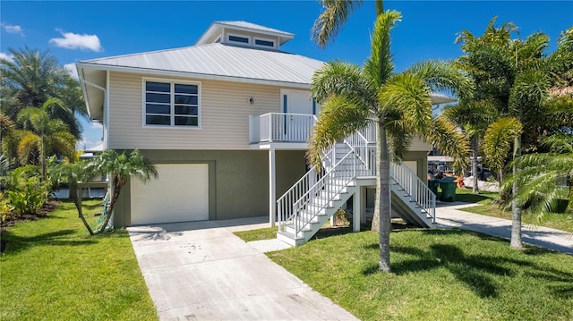 view of front of property with a front yard and a garage