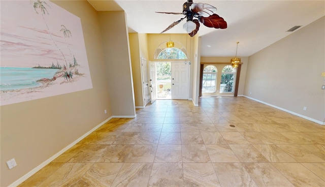 tiled foyer entrance with ceiling fan