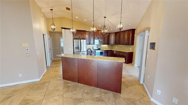 kitchen featuring hanging light fixtures, backsplash, stainless steel appliances, vaulted ceiling, and light stone countertops