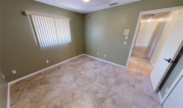 tiled empty room with ceiling fan