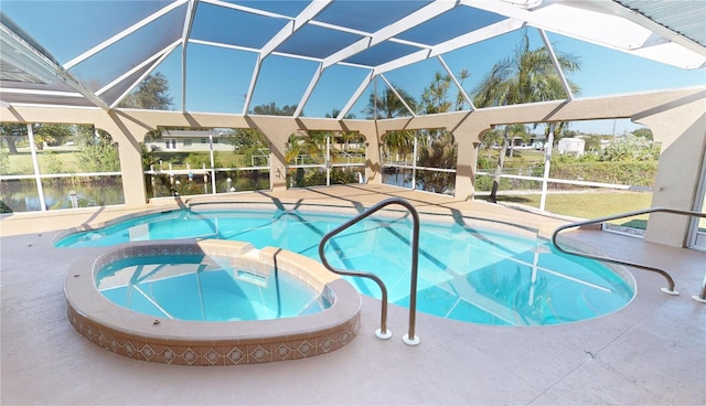 view of swimming pool featuring a patio area, an in ground hot tub, and glass enclosure