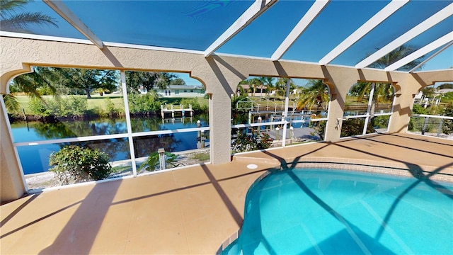 view of pool featuring a water view and a patio area