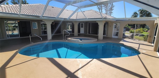 view of pool featuring an in ground hot tub, a lanai, and a patio area