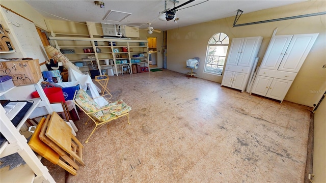 garage featuring a garage door opener and ceiling fan