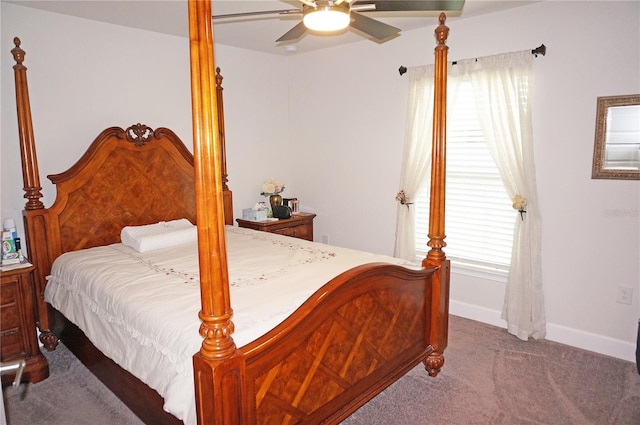 bedroom with ceiling fan and dark carpet