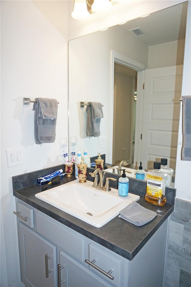 bathroom with tile floors and large vanity