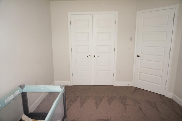 carpeted bedroom featuring a closet