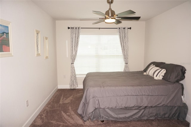 bedroom featuring dark colored carpet and ceiling fan