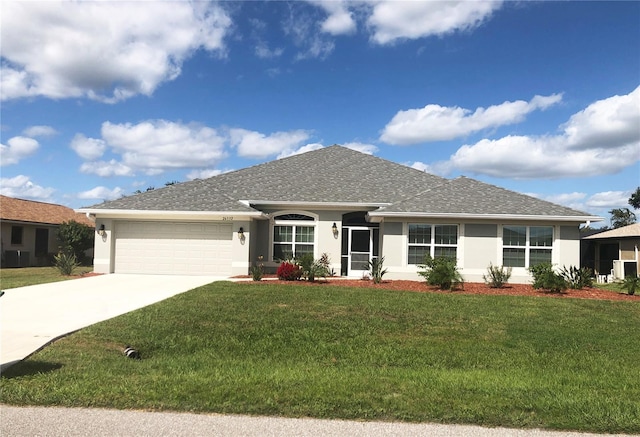 single story home featuring a front lawn and a garage