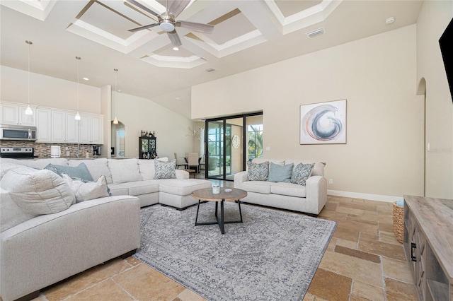 living room featuring coffered ceiling, light tile floors, beam ceiling, a high ceiling, and ceiling fan