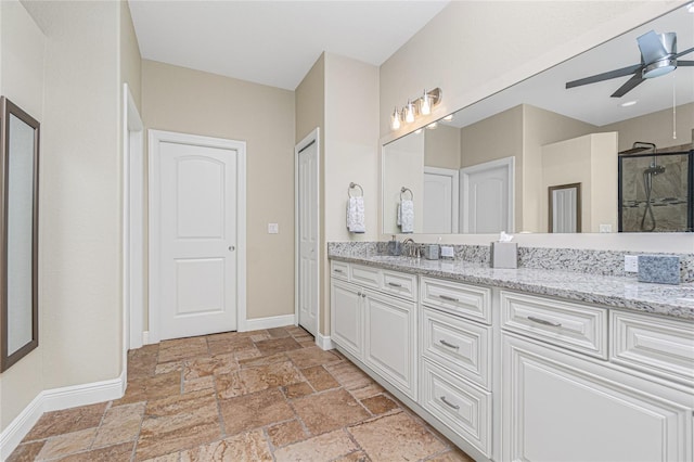 bathroom featuring tile flooring, ceiling fan, and vanity