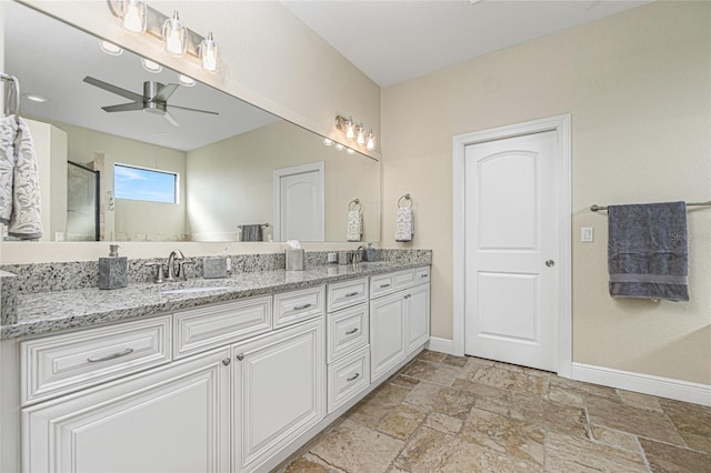 bathroom with double vanity, tile floors, and ceiling fan