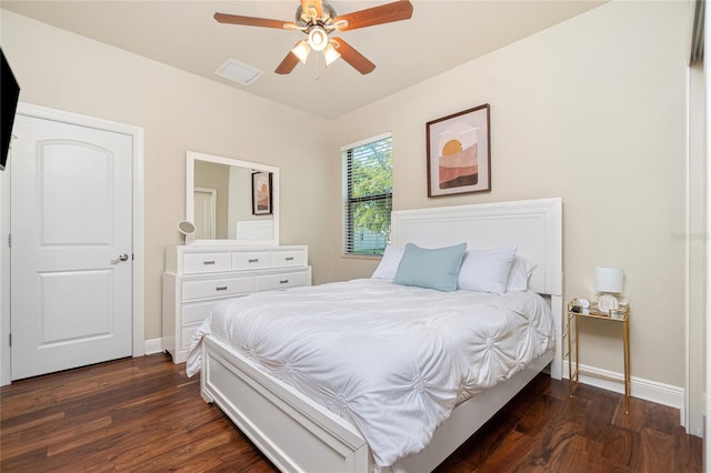 bedroom featuring ceiling fan and dark hardwood / wood-style floors