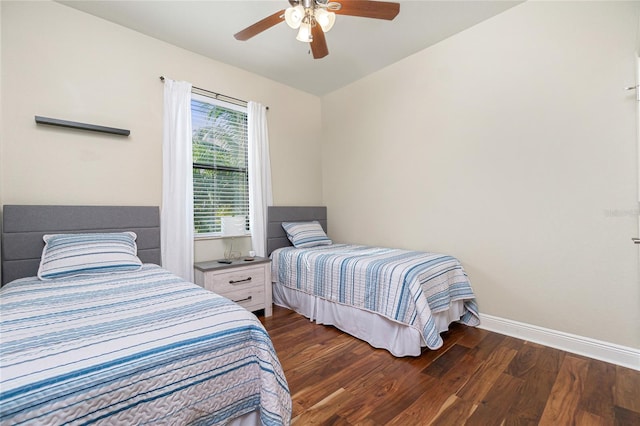 bedroom featuring dark hardwood / wood-style floors and ceiling fan