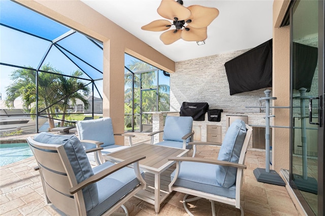 sunroom featuring ceiling fan