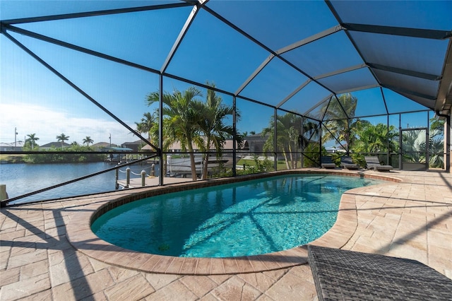 view of swimming pool featuring glass enclosure and a patio area