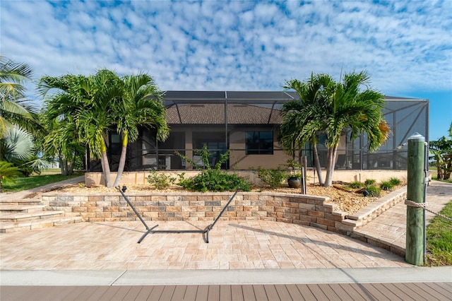 exterior space with a patio and a lanai