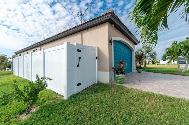 garage with a yard