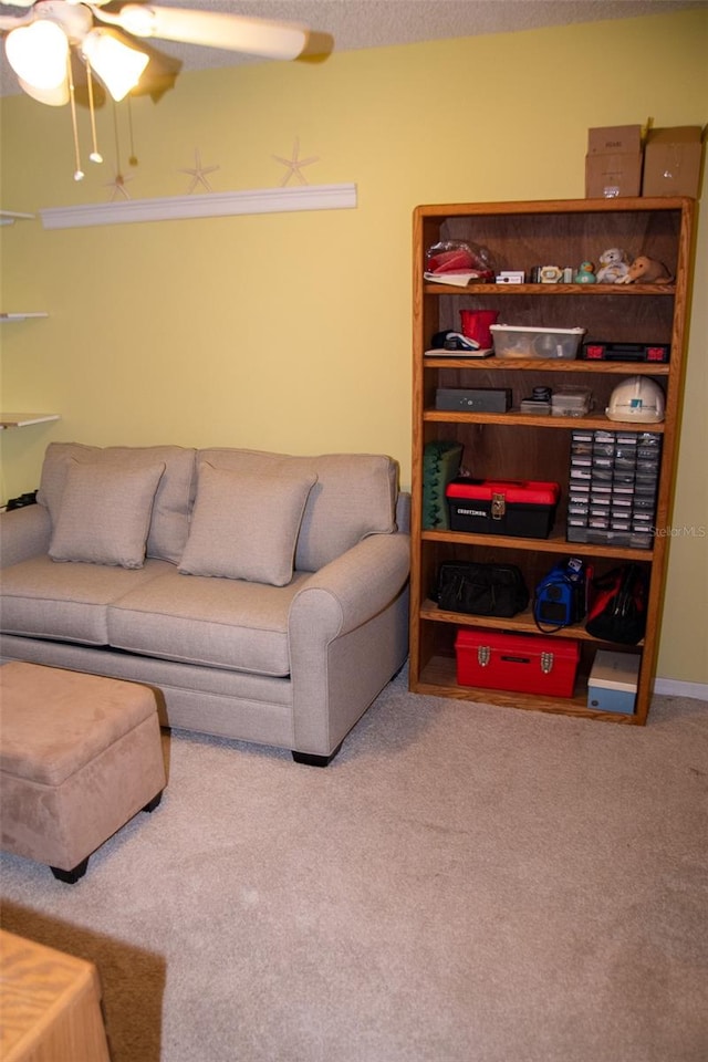 carpeted living room with ceiling fan and a textured ceiling