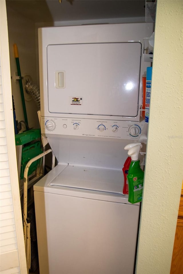 laundry room featuring stacked washing maching and dryer