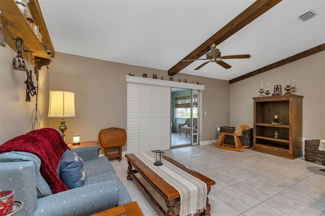 living room with light tile floors, ceiling fan, and lofted ceiling with beams