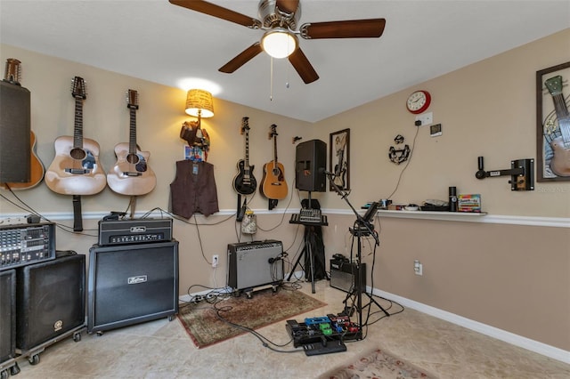 misc room with light tile flooring and ceiling fan