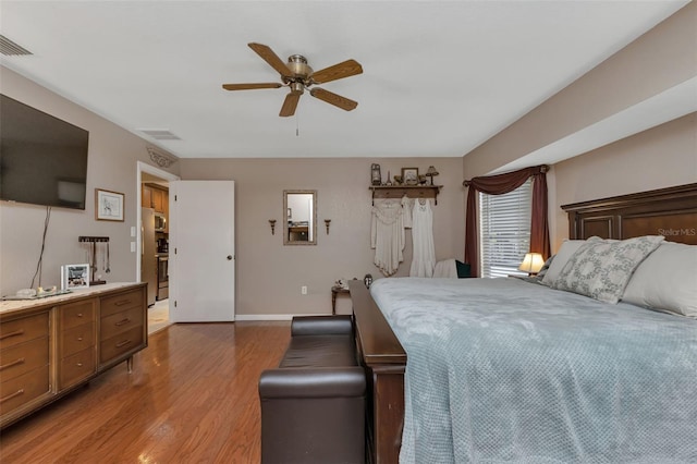 bedroom featuring hardwood / wood-style floors and ceiling fan