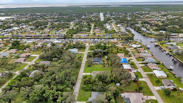 drone / aerial view with a water view