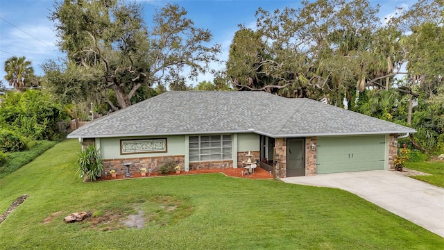 view of front facade with a front yard and a garage