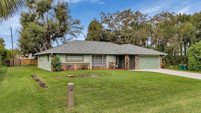 view of front of property with a front lawn and a garage