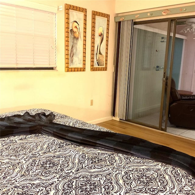 bedroom with hardwood / wood-style flooring