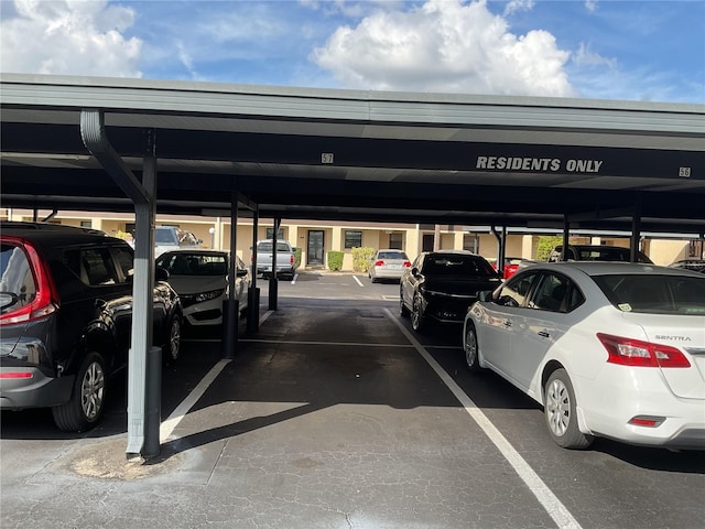 view of vehicle parking featuring a carport