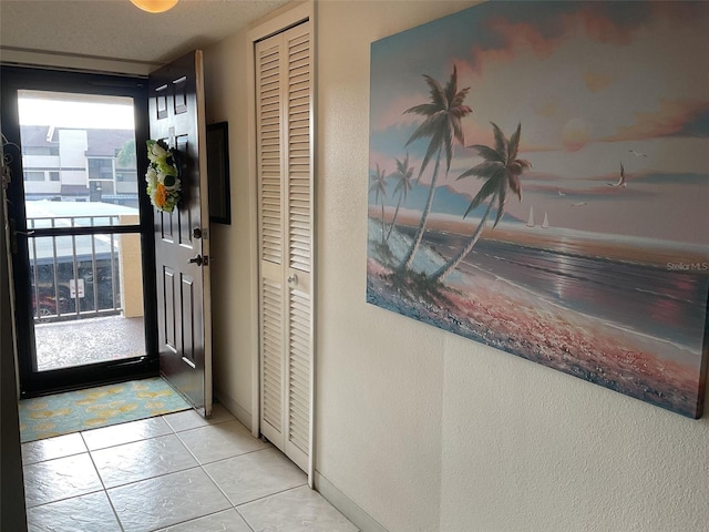 view of tiled foyer entrance