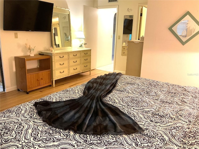 bedroom with wood-type flooring