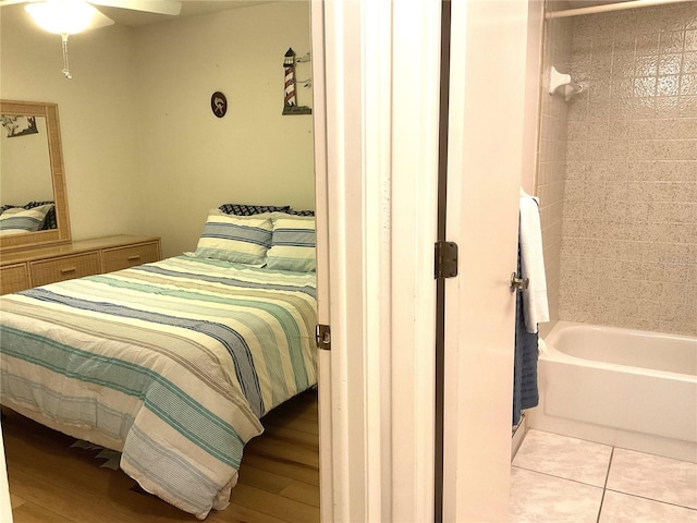 bedroom with light hardwood / wood-style flooring and ceiling fan