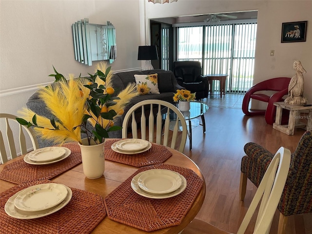 dining area with hardwood / wood-style floors